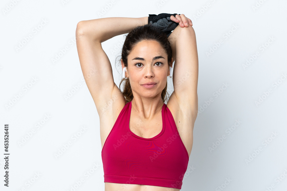 Sport woman over isolated white background stretching