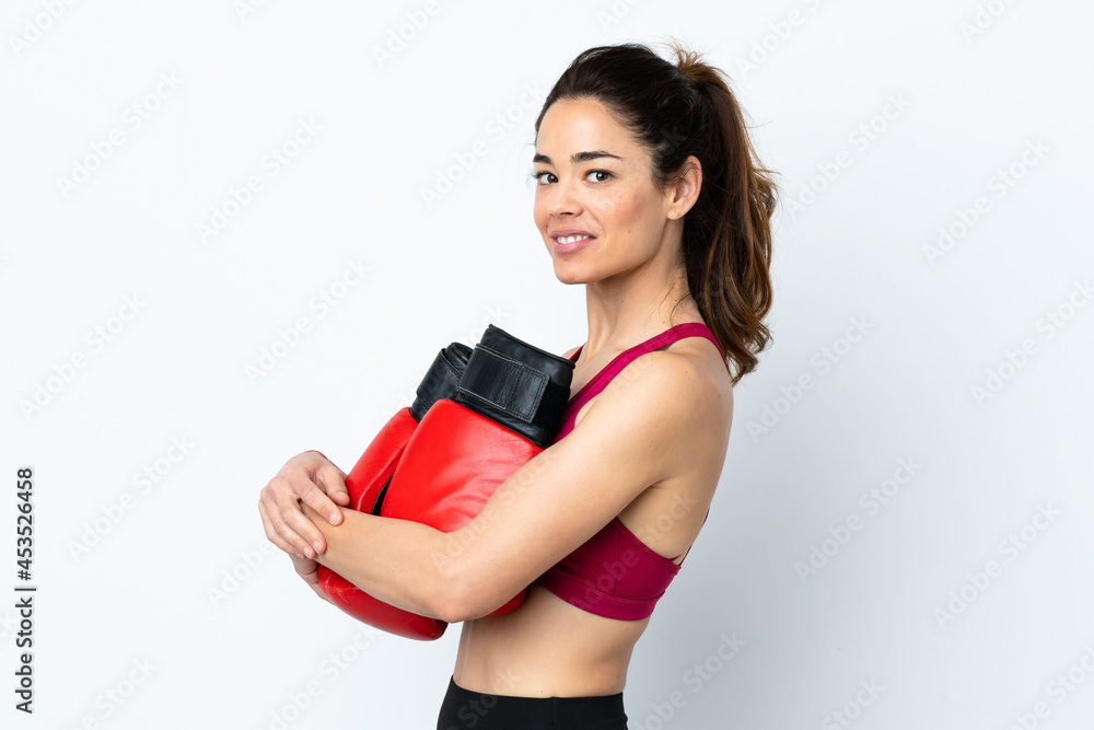 Sport woman over isolated white background with boxing gloves Sport woman over isolated white background with boxing gloves
