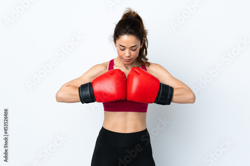 Sport woman over isolated white background with boxing gloves