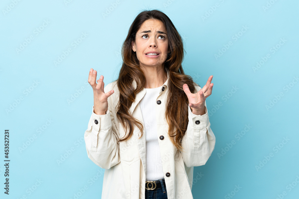 Woman over isolated background stressed overwhelmed Woman over isolated background stressed overwhelmed