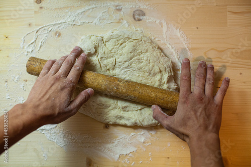 hands kneading dough