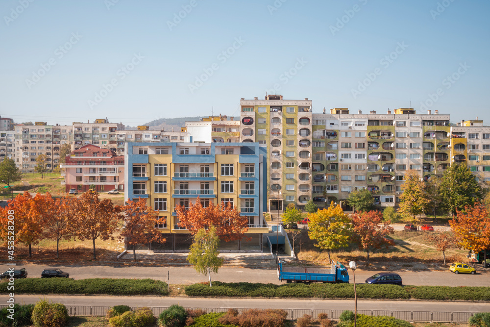 Facades of buildings of different colors on a street in Kardhali in Bulgaria