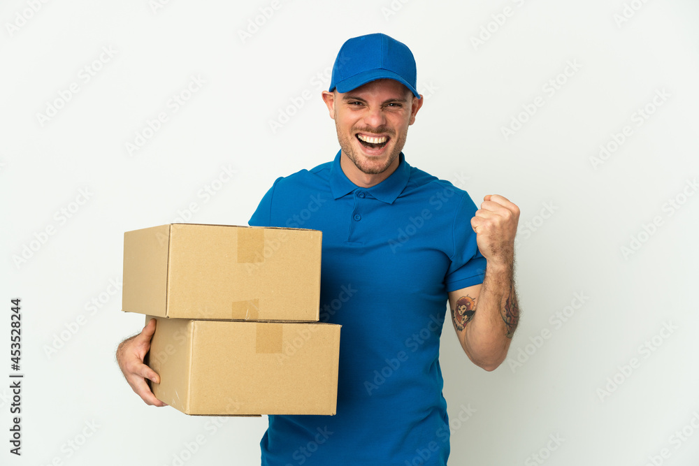 Delivery caucasian man isolated on white background celebrating a victory in winner position Delivery caucasian man isolated on white background celebrating a victory in winner position