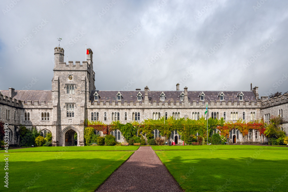Lawn, gardens and neo-gothic façade of the University of Cork in the South of the Republic of Ireland