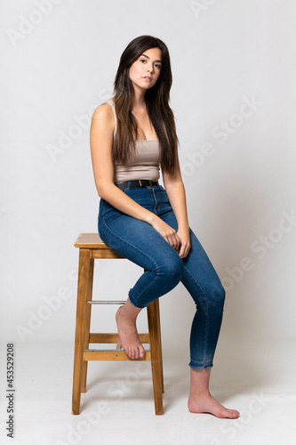 Teenager Brazilian girl over isolated background