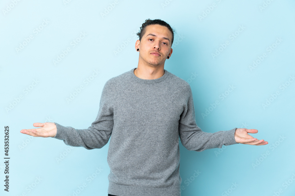 Caucasian man over isolated background having doubts Caucasian man over isolated background having doubts