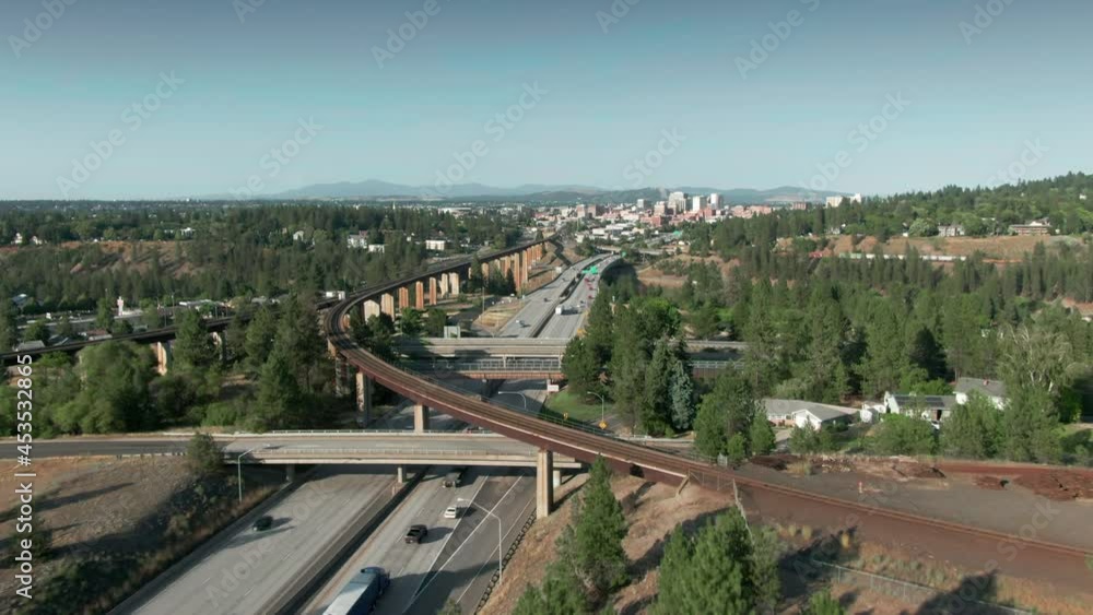 Aerial: Traffic on the Interstate 80 and city skyline, Spokane, Washington, USA Aerial: Traffic on the Interstate 80 and city skyline, Spokane, Washington, USA