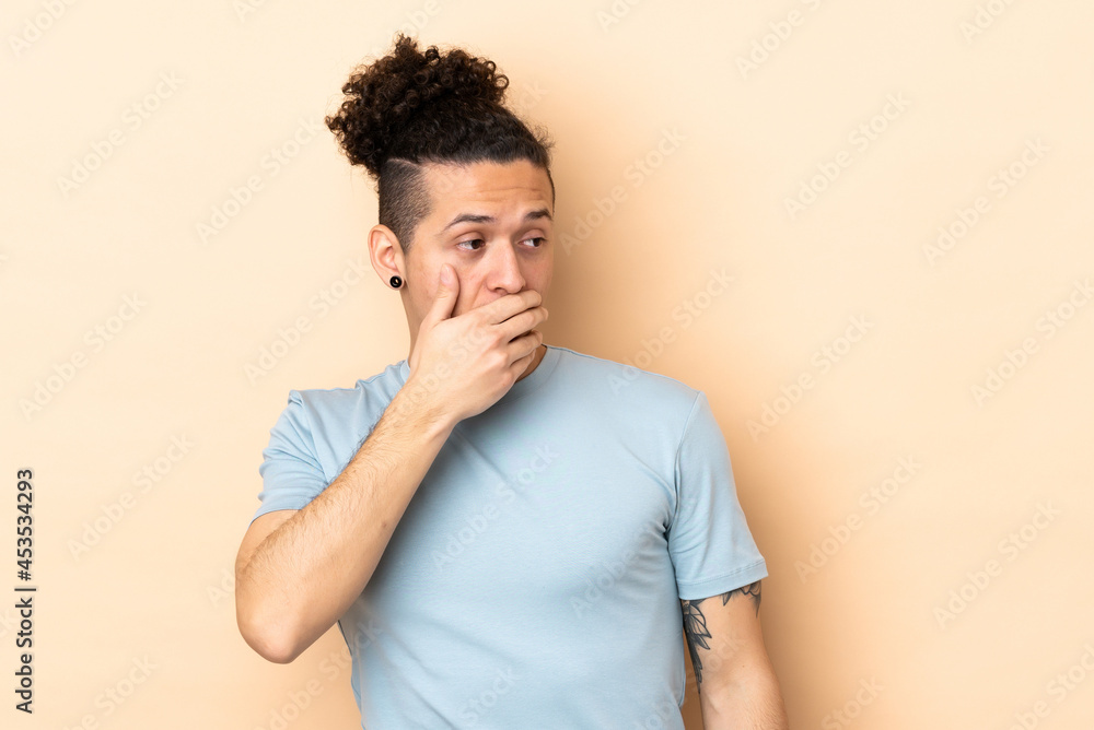 Caucasian man over isolated background doing surprise gesture while looking to the side Caucasian man over isolated background doing surprise gesture while looking to the side
