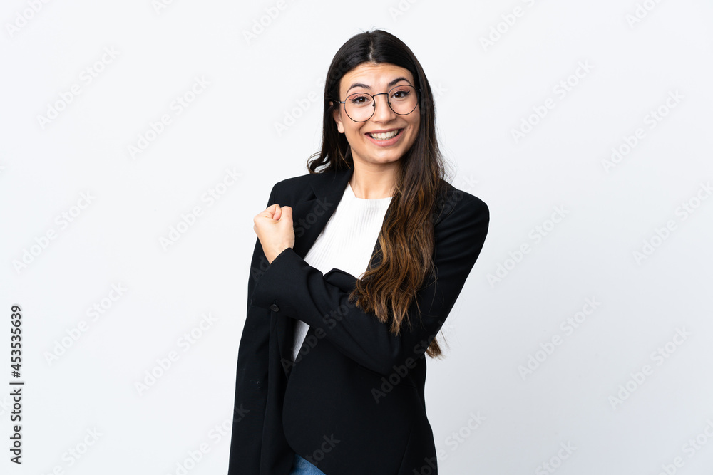 Business woman over isolated white background celebrating a victory Business woman over isolated white background celebrating a victory