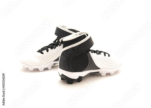 Cuadro en lienzo Brand new pair of baseball cleats, baseball shoes for kids isolated on white bac