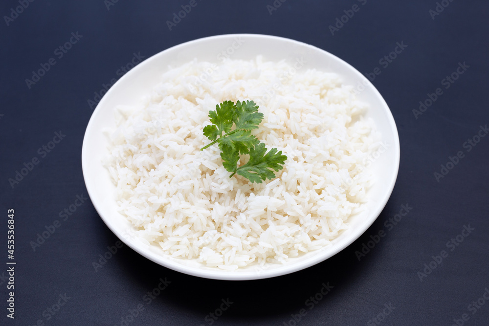 Dish of rice on dark background. Dish of rice on dark background.