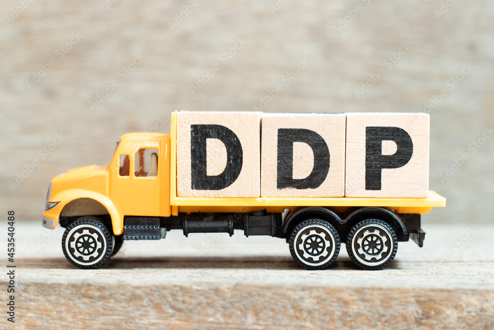 Φωτογραφία Toy truck hold alphabet letter block in word DDP (Abbreviation of Delivered duty
