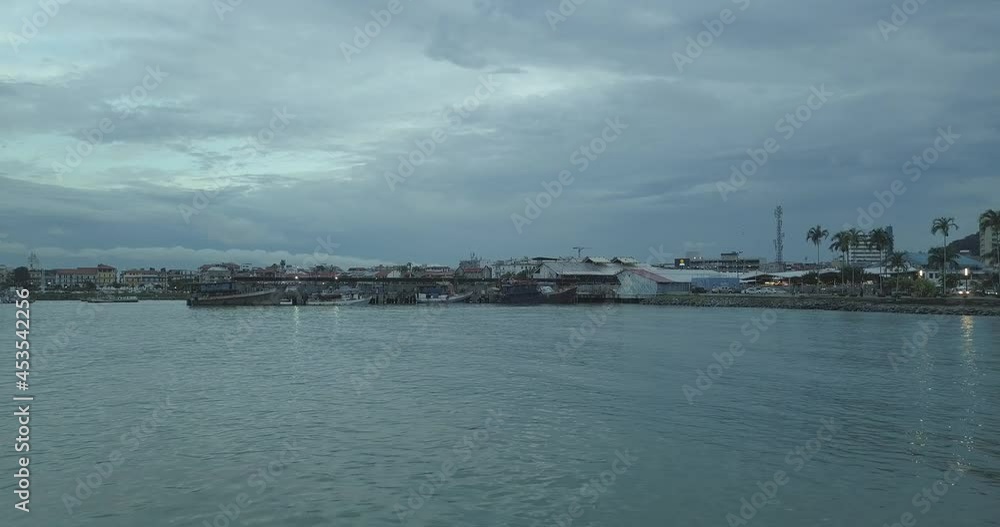 approaching boats stopped in a port approaching boats stopped in a port