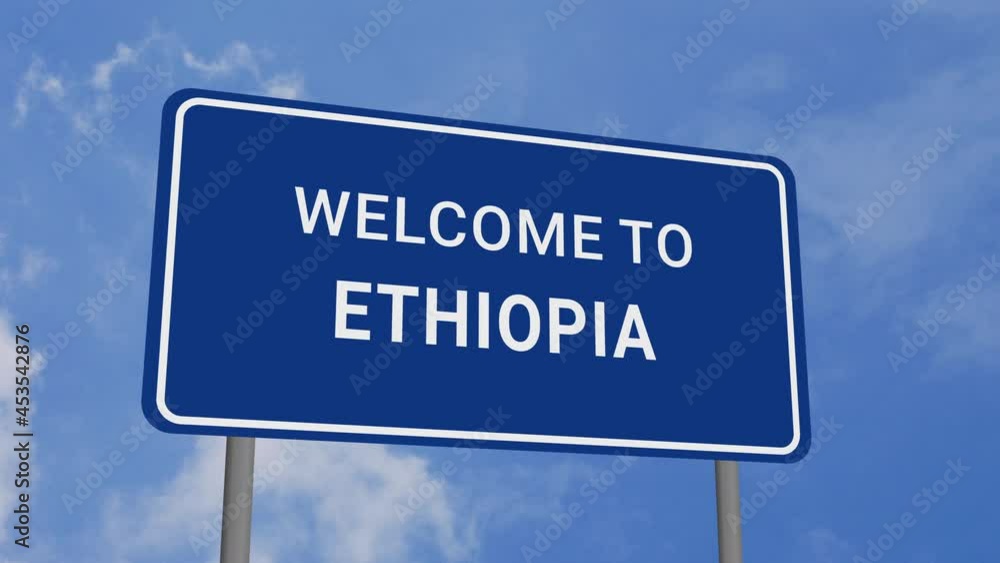 Welcome to Ethiopia Road Sign on Clear Blue Sky with Rapid Moving Clouds Welcome to Ethiopia Road Sign on Clear Blue Sky with Rapid Moving Clouds