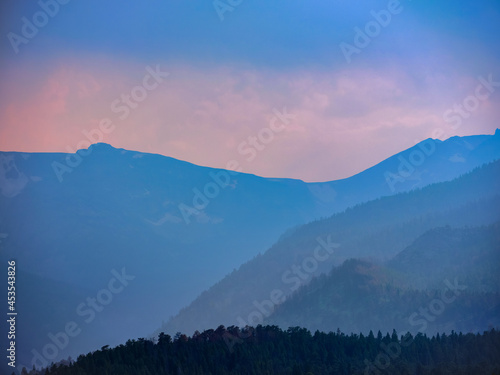 Layers at sunset in light rain in the Rocky Mountains