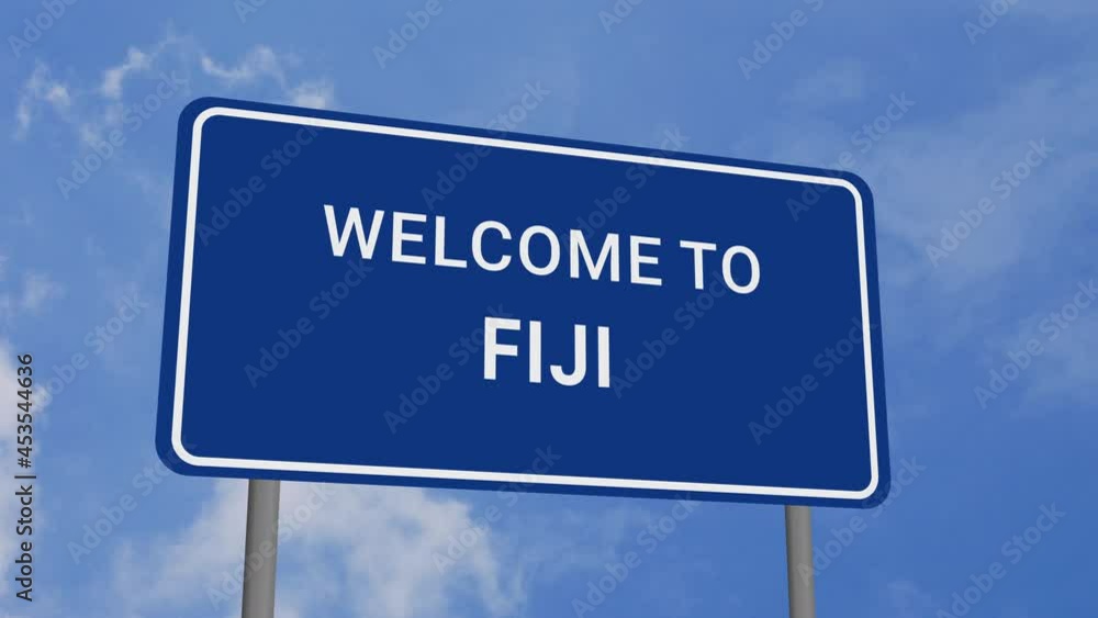 Welcome to Fiji Road Sign on Clear Blue Sky with Rapid Moving Clouds Welcome to Fiji Road Sign on Clear Blue Sky with Rapid Moving Clouds