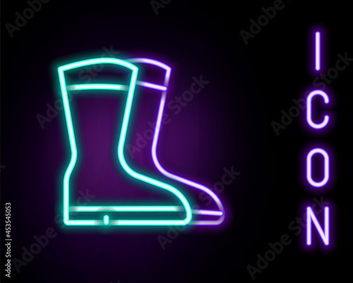 Glowing neon line Fishing boots icon isolated on black background. Waterproof rubber boot. Gumboots for rainy weather, fishing, hunter, gardening. Colorful outline concept. Vector