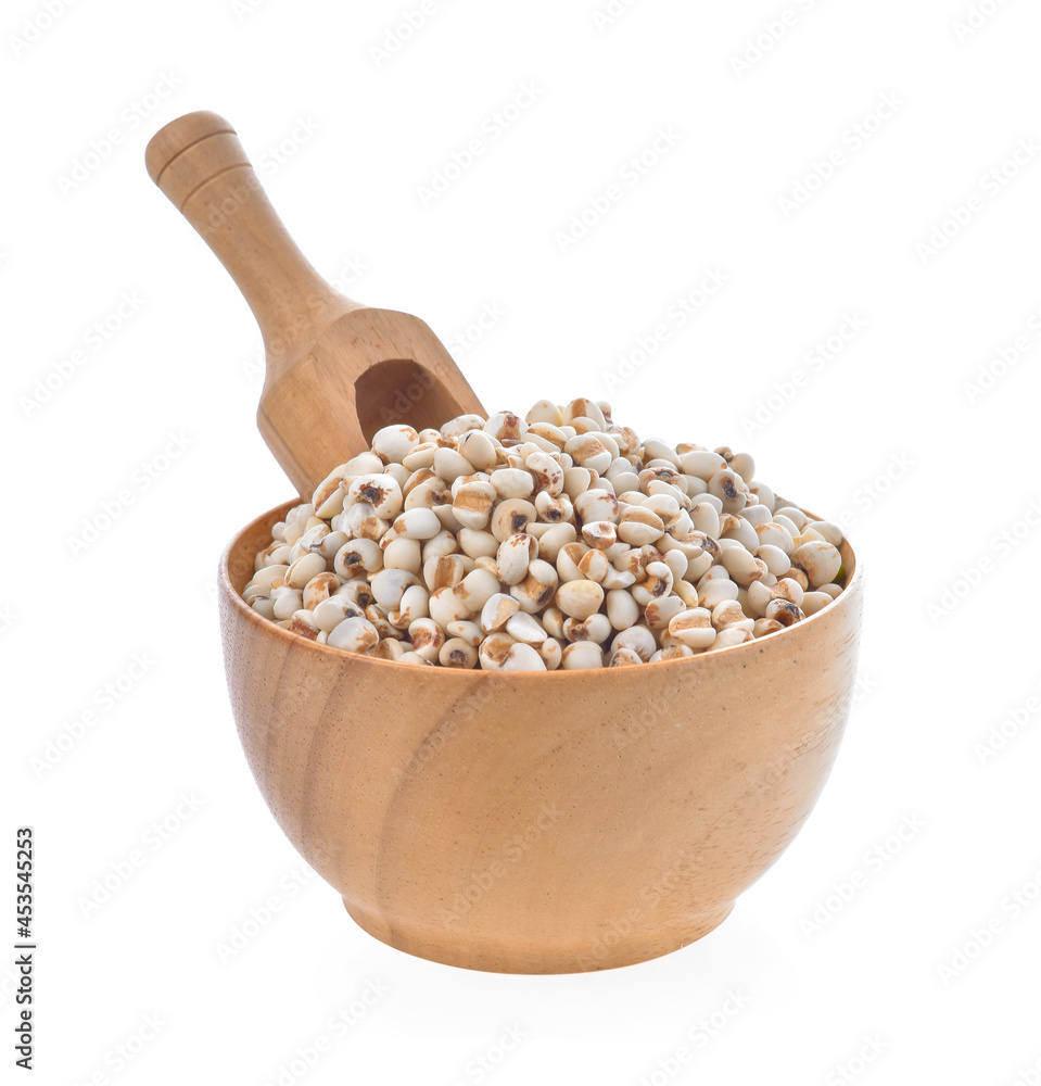 millet in wood bowl on white background millet in wood bowl on white background