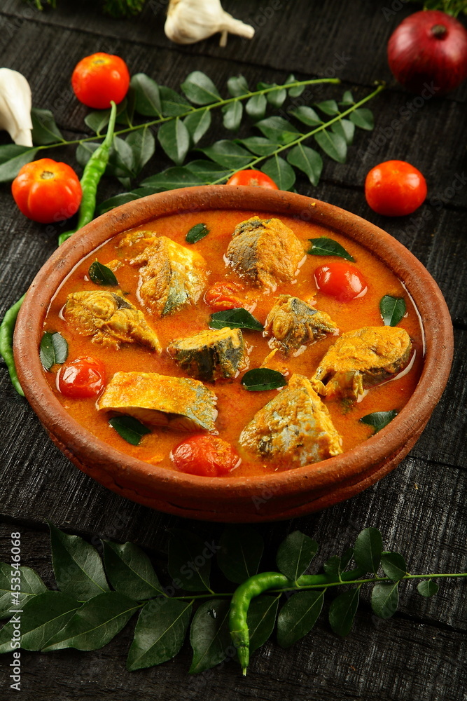 Homemade delicious Kerala fish curry, cooked in clay pottery.