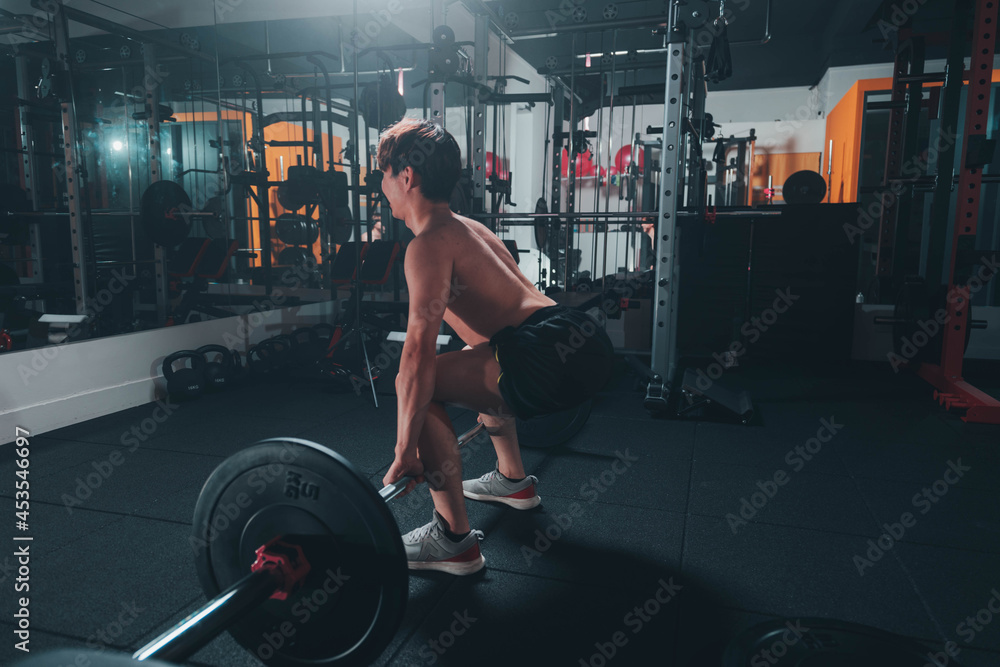 man doing deadlift in gym man doing deadlift in gym