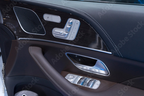 Close up of buttons for adjusting seat position of new modern car.