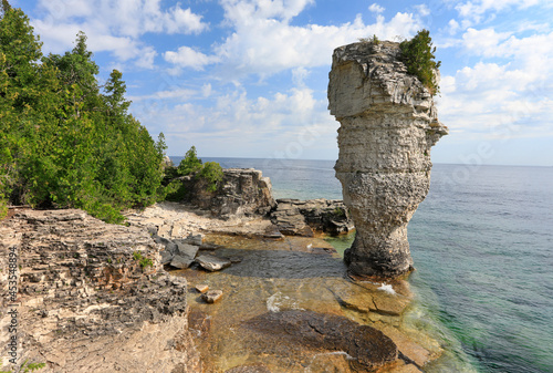 Rock pillar rise from the waters of Georgian Bay on Flowerpot island in Fathom Five National Marine Park, Lake Huron, Canada
