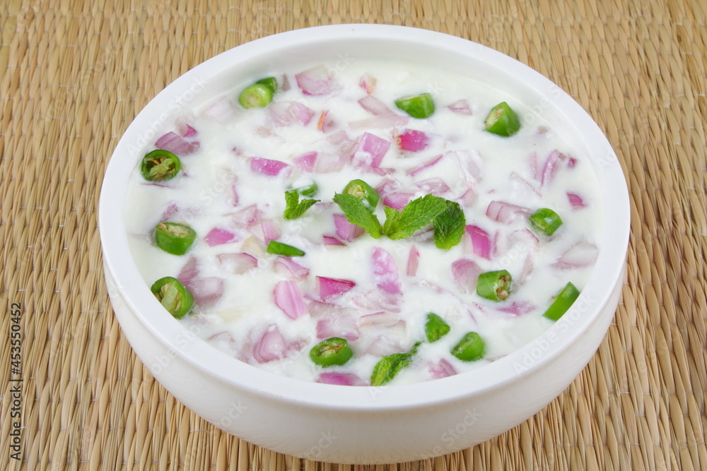 Fresh homemade raitha, cucumber salad with green chili and onions. Fresh homemade raitha, cucumber salad with green chili and onions.