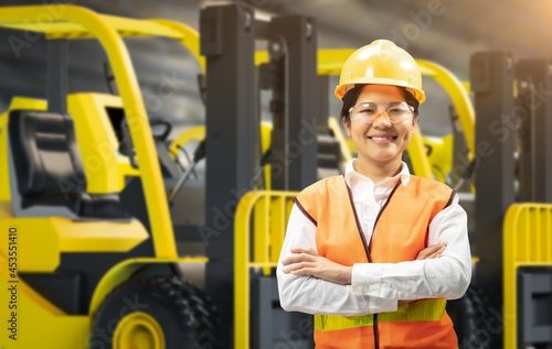 Asian engineer or technician with forklift trucks