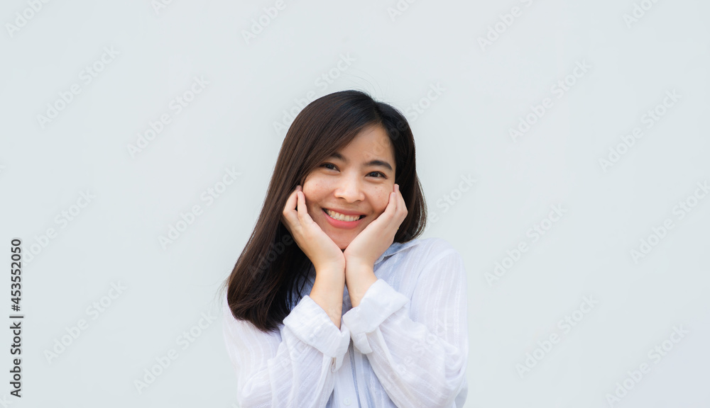 close up attractive adult business woman asian girl with happy and smile against white concrete wall office. close up attractive adult business woman asian girl with happy and smile against white concrete wall office.