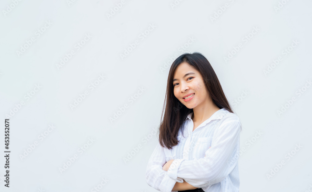 close up attractive adult business woman asian girl with happy and smile against white concrete wall office. close up attractive adult business woman asian girl with happy and smile against white concrete wall office.