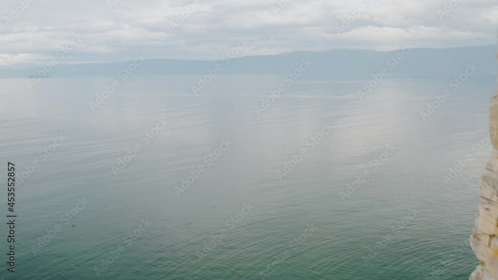 Beautiful lake behind the rock Summer Baikal lake Olkhon island Beautiful lake behind the rock Summer Baikal lake Olkhon island