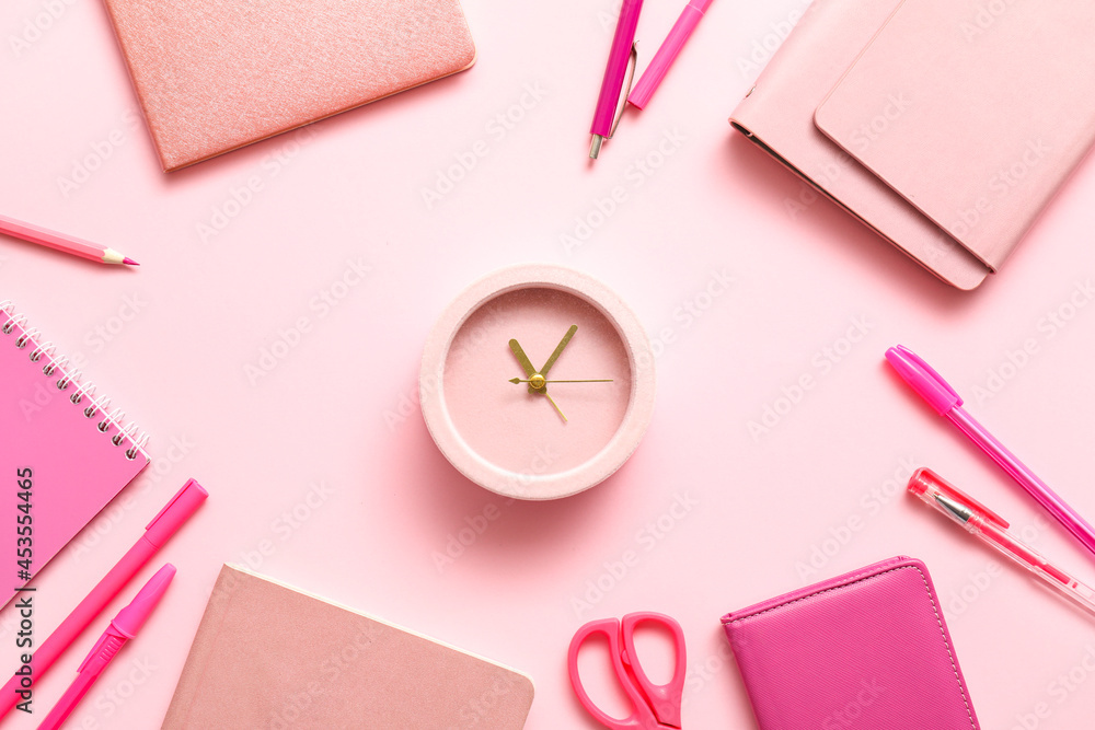 Alarm clock with office supplies on color background Alarm clock with office supplies on color background