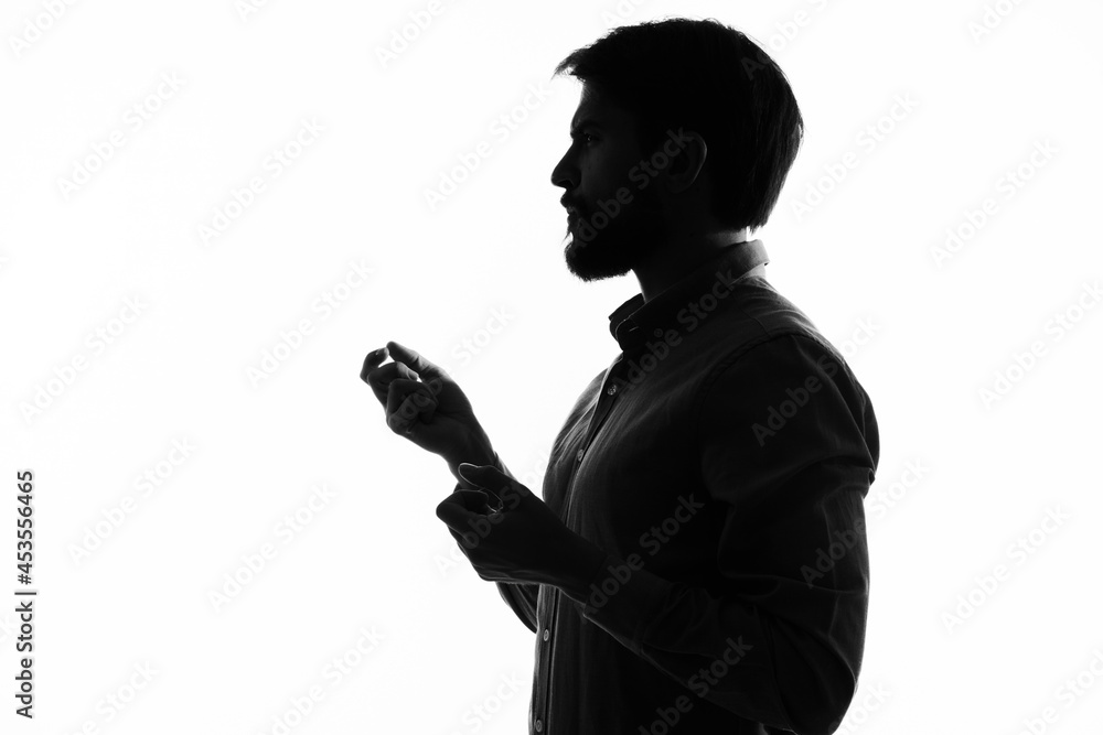 The man in a suit gun in the hands of the emotions silhouette isolated background