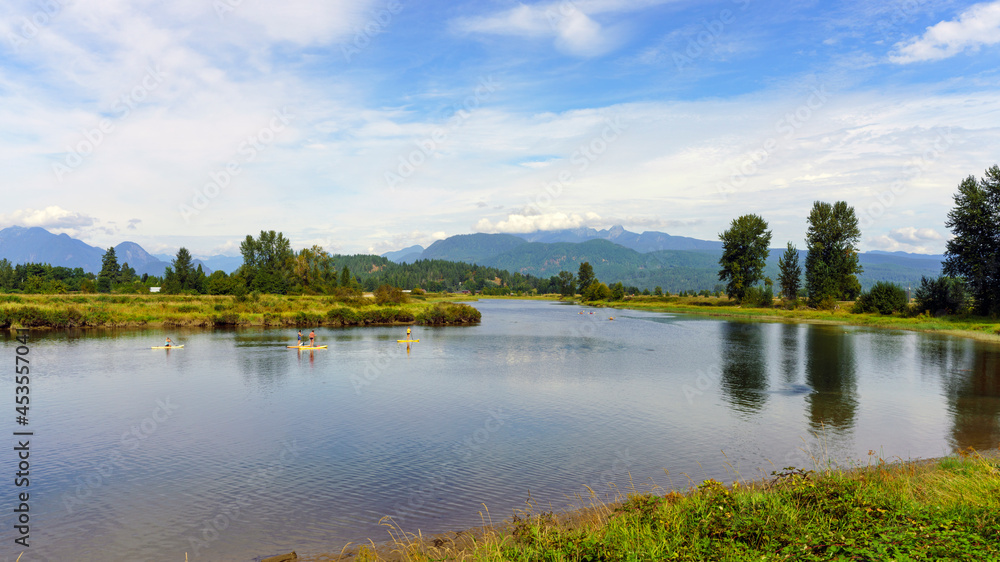 Scenic Alouette River, near Pitt Meadows, BC, a popular venue for kayakers, canoeists and paddleboarders with spectacular mountain backdrop.