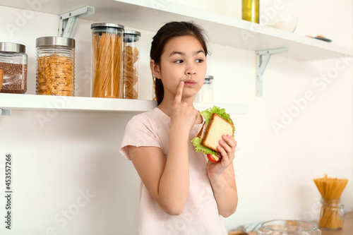 Thoughtful little girl with...