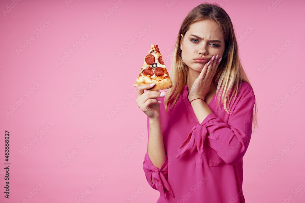 cheerful blonde with pizza in her hands junk food snack pink background cheerful blonde with pizza in her hands junk food snack pink background