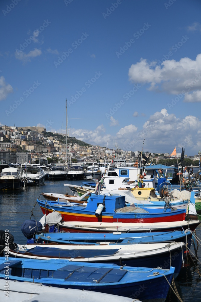 Boats on a beach in Naples, a city in southern Italy.