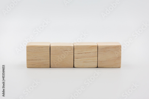 Four blank wooden block cubes on a white background for your text.