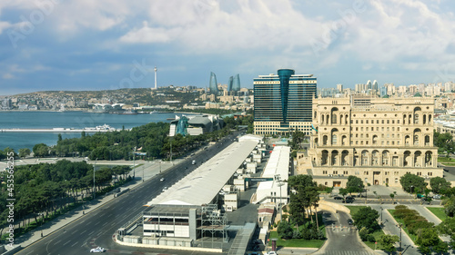 Baku, Azerbaijan - July 2019: Baku cityscape with Caspian Sea, Azeri parliament and Flame Towers.