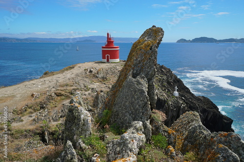 Lighthouse and rock on the Atlantic coast in Galicia, Spain, Pontevedra province, Cangas, Cabo Home