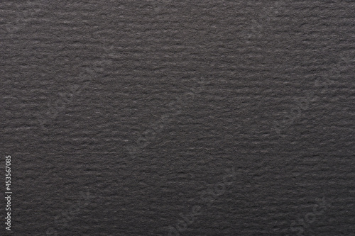 Clean matte dark black paper surface