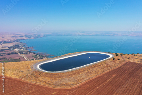 Water reservoir on top of Arbel cliff overlooking The Sea of Galilee  Aerial view.
