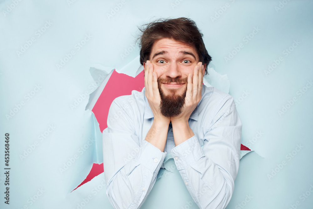 man in blue shirt breaks through the background Job business man in blue shirt breaks through the background Job business