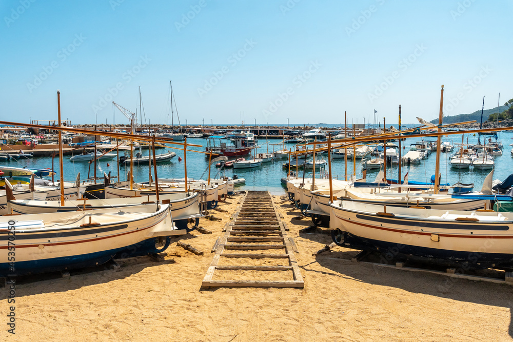 Beach full of boats in Llafranc, Girona on the Costa Brava of Catalonia in the Mediterranean