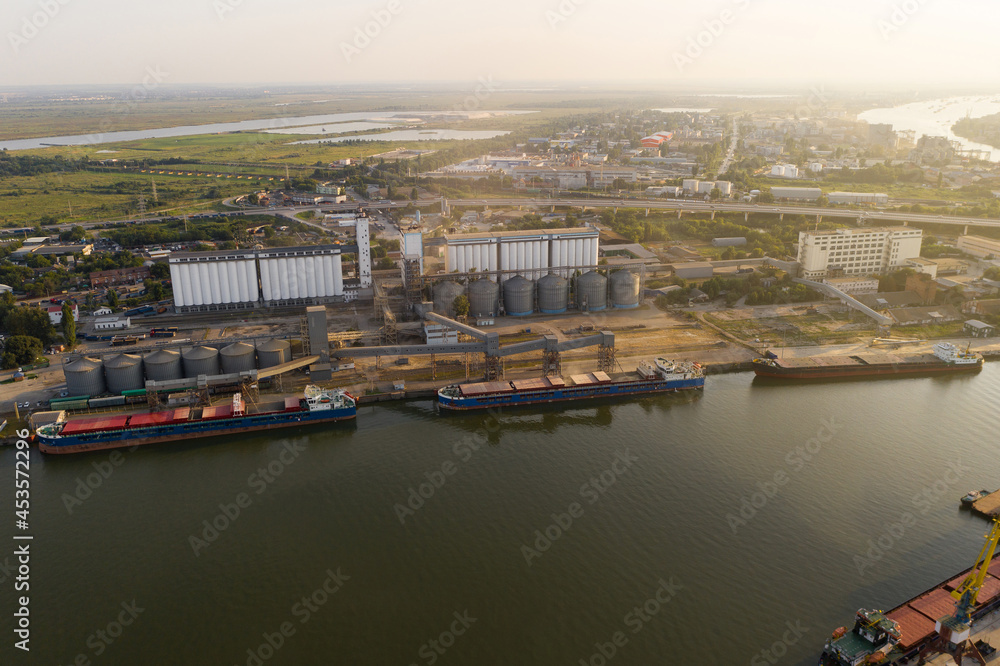 Loading ships with wheat grain for export in the port. Aerial view	