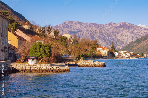 Beautiful Mediterranean landscape on sunny winter day. Montenegro, Adriatic Sea, Kotor Bay. View of Prcanj town