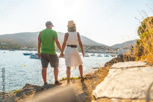 A couple on vacation in Cadaques enjoying the summer, Costa Brava of Catalonia, Gerona, Mediterranean Sea. Spain photo