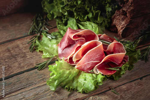 Prosciutto with rosemary and fresh lettuce salad.