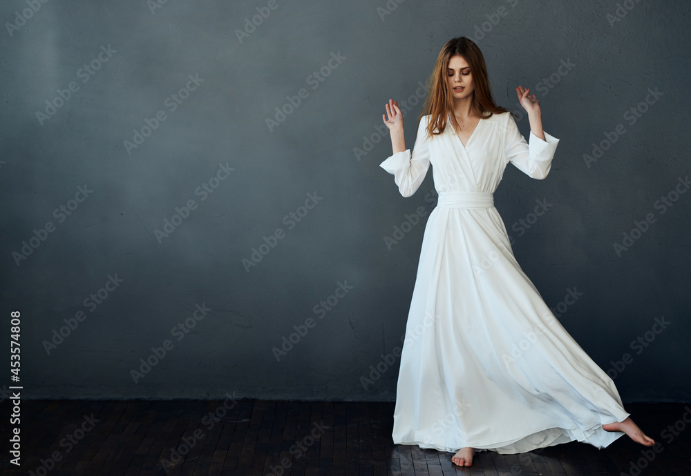 pretty woman dancing in white dress studio isolated background fashion pretty woman dancing in white dress studio isolated background fashion