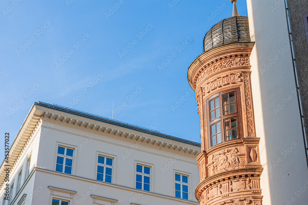 classical urban architecture in Leipzig, Germany. Street corner with elaborately decorated round oriel on one of the buildings